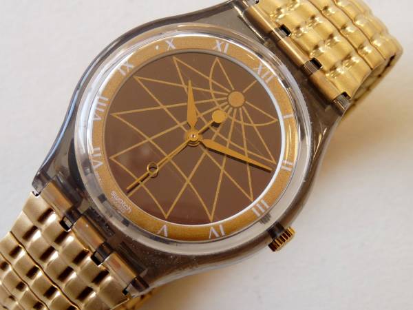 未使用 珍品ソーラー スウォッチ Swatch 金/黒 蛇腹ベルトSRM101 ベルトスモールサイズふ_蛇腹ベルト　3センチほど伸びます