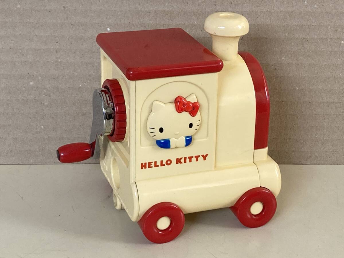  that time thing Hello Kitty manual pencil sharpener . car ( postage 520 jpy )