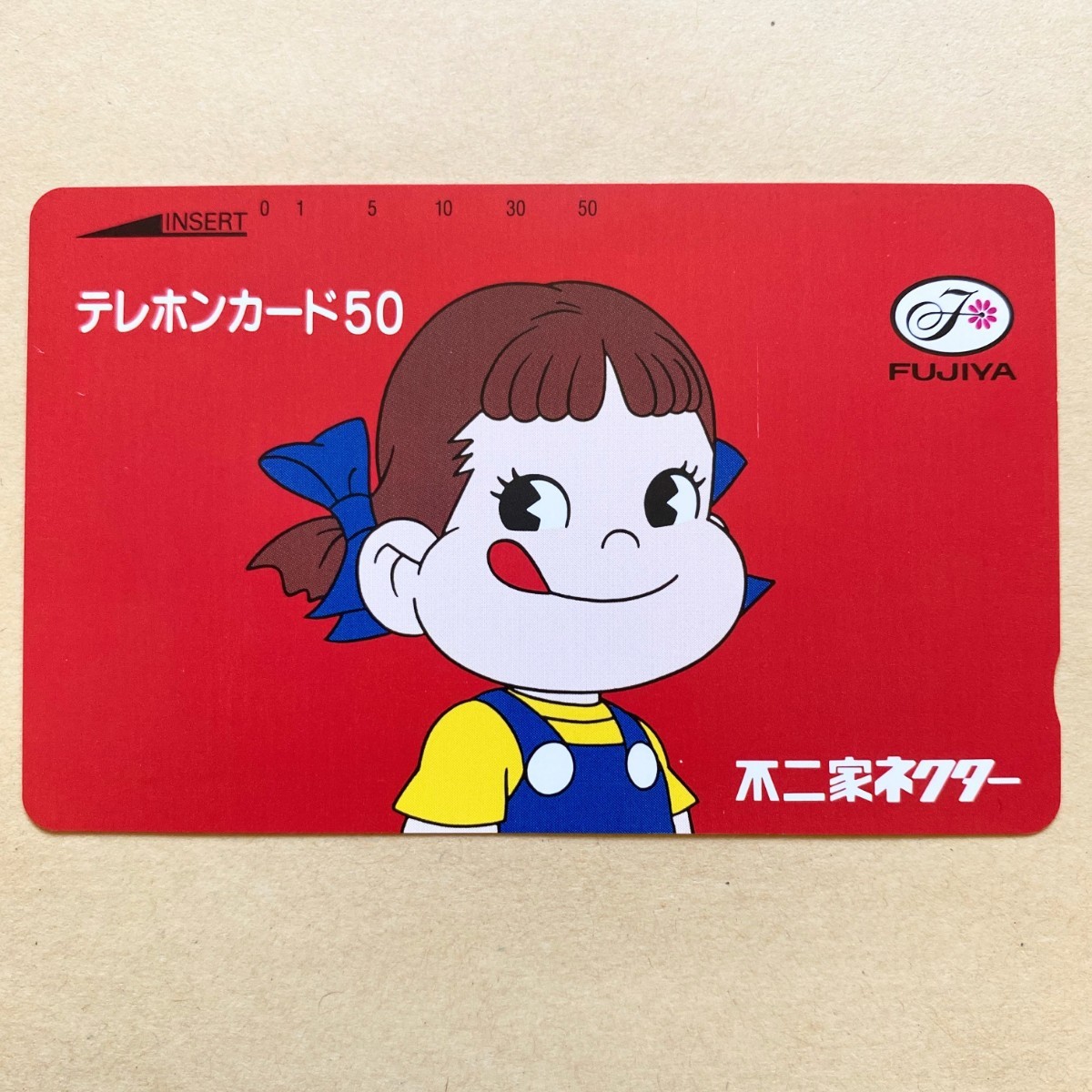 [ unused ] telephone card Peko-chan Fujiya nekta-