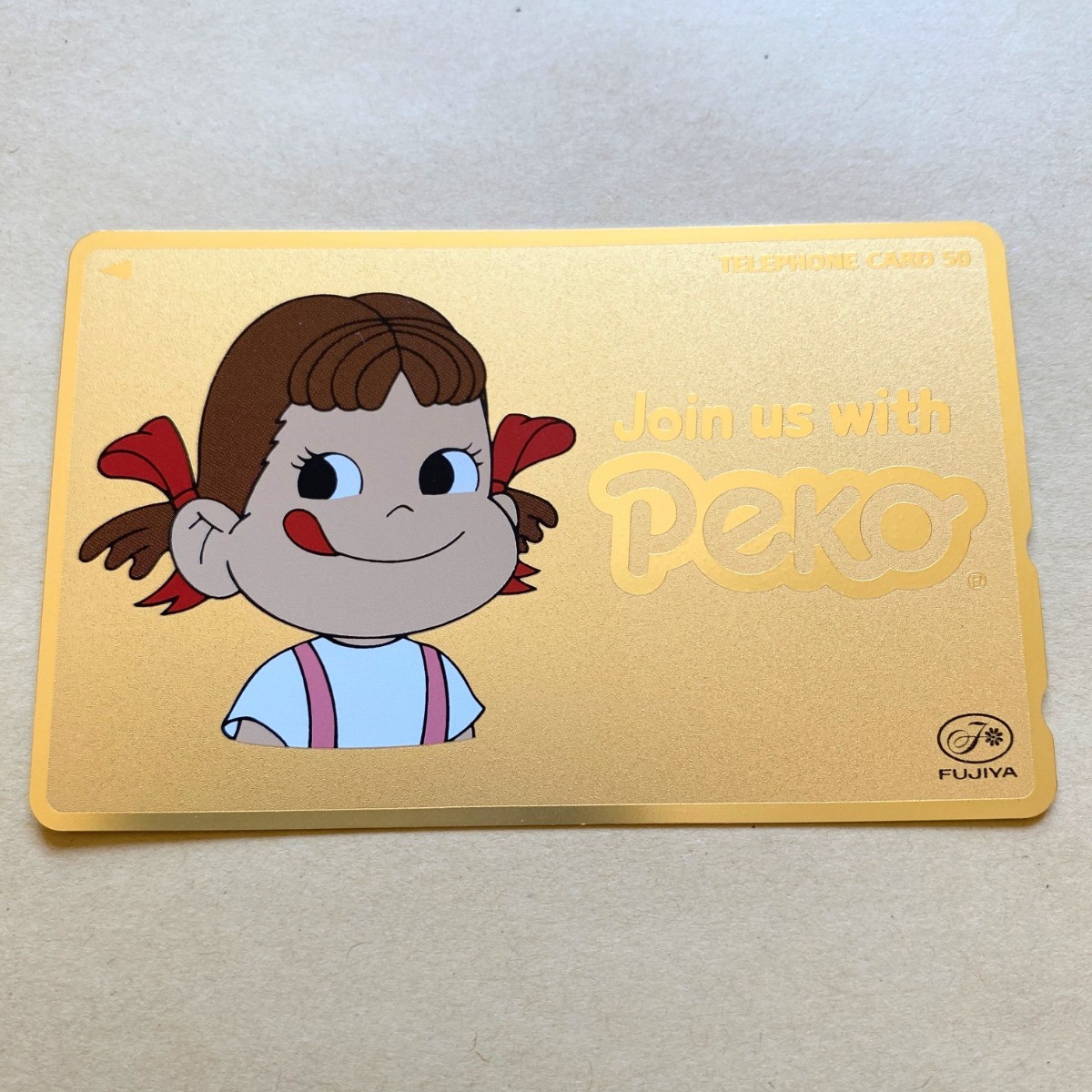 【未使用】テレカ ペコちゃん Join us with Peko ゴールド 不二家_画像1