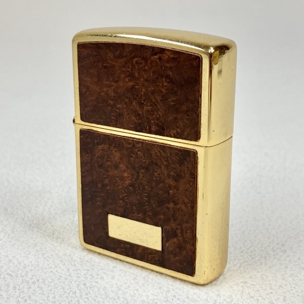 【ZIPPO】ジッポ 木目調 ウッド wood ゴールドカラー 金色 1999年製造 オイルライター USA 喫煙具 マニア品 コレクション 中古 現状品の画像1