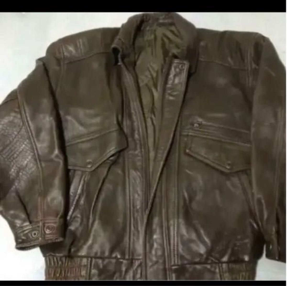 ライダースジャケット、古着    サイズ　L .   茶色。