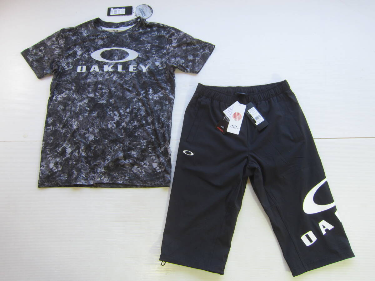 新品◆オークリーOAKLEY 半袖 Tシャツ & ７分丈 ショート パンツ M 黒 迷彩 UVカット 抗菌防臭 吸汗速乾 4WAYストレッチ トレーニング /L