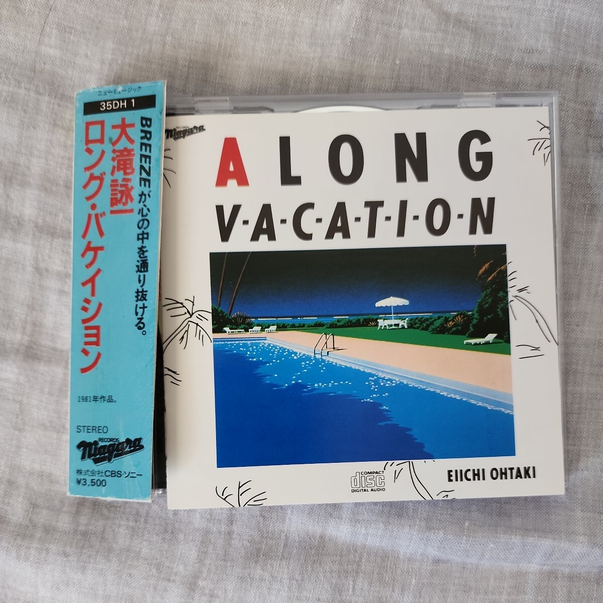 ☆ 大瀧詠一 ロング バケイション 旧規格帯付(訳あり)　35DH1 141csr刻印 規格 NGCD7OT LONG VACATION大滝詠一CD税表記無Editionナイアガラ_画像1