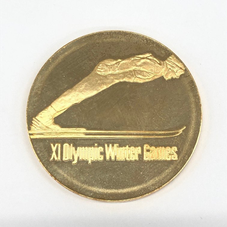 K18 750刻印 第11回札幌オリンピック冬季大会記念金メダル 26.8g【CCBB6026】_画像1