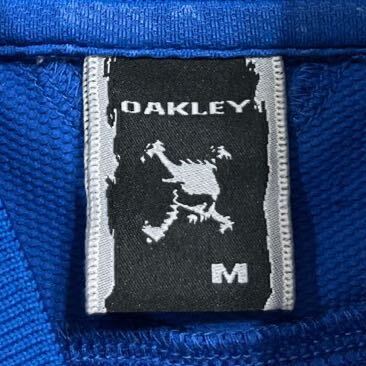 74 美品 OAKLEY オークリー ストレッチ 総柄 半袖 ポロシャツ GOLF ゴルフ サイズM ロゴ刺繍 ロゴボタン スポーツ ブルー 青 40430AD_画像3