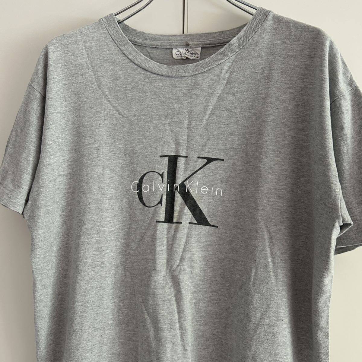 90s Calvin Klein カルバンクライン USA製 ロゴプリントTシャツ S-M 袖裾シングル グレー 企業 センターロゴ 古着の画像1