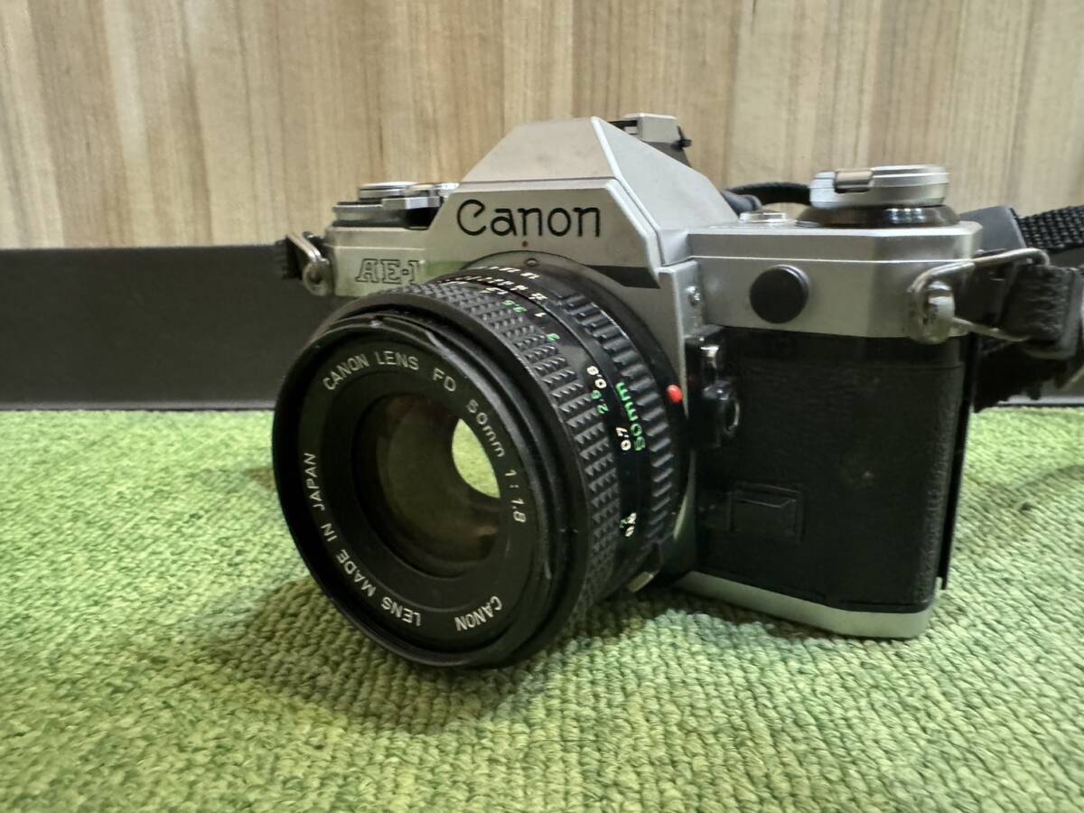 H5643 1円～ Canon キャノン AE-1 一眼レフ フィルムカメラ カメラ CANON LENS FD 50mm 1:1.8 ストラップ付き マニュアルの画像3