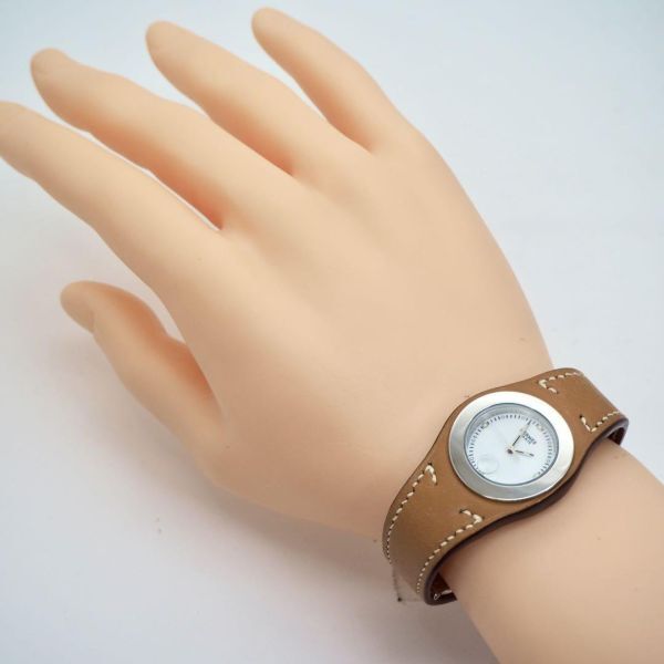 79[OH ending ]HERMES Hermes clock a-ne lady's wristwatch Brown 