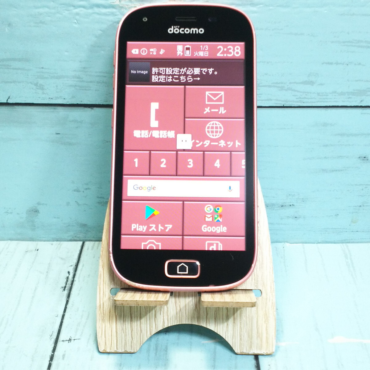 docomo F-03K ピンク らくらくスマートフォン me 本体 白ロム SIMロック解除済み SIMフリー 691697_画像1