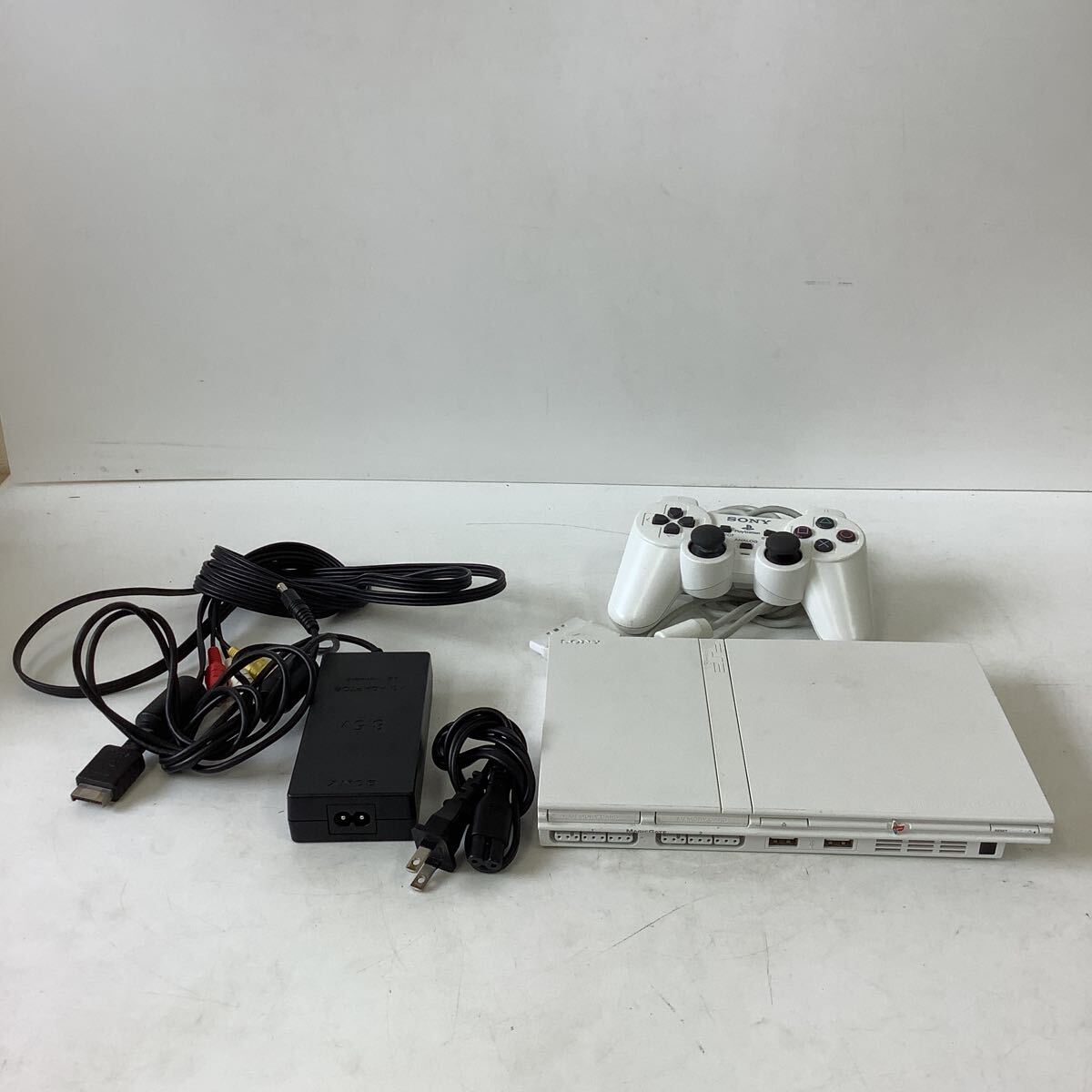 0.TK035-A9T60[ Saitama departure ]SONY PlayStation2 SCPH-77000 white thin type electrification simple operation verification ending 