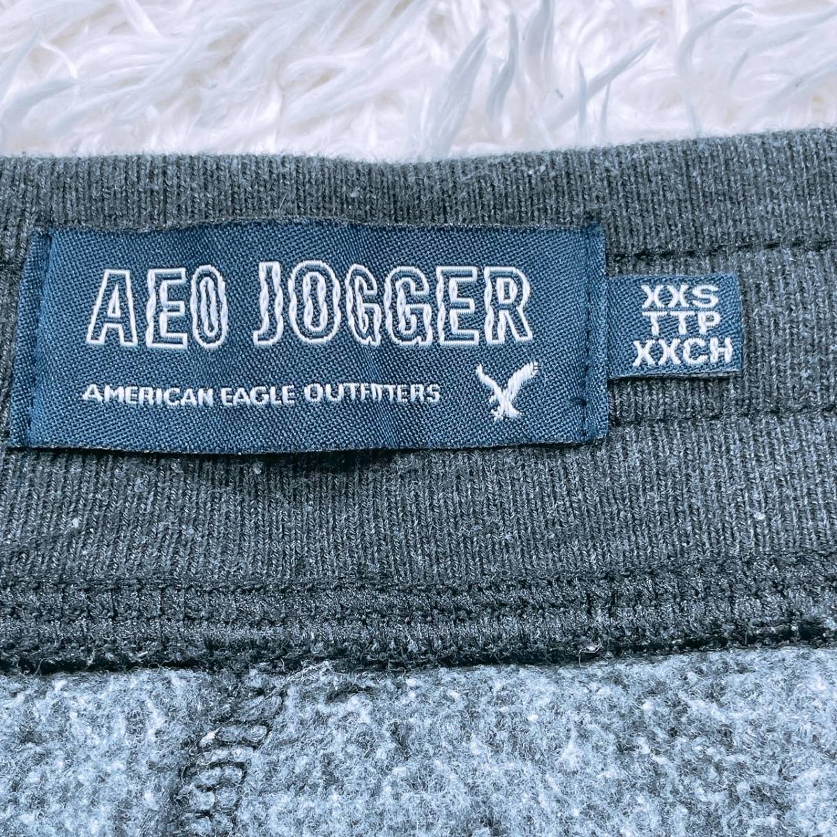 レディースXXS AEO JOGGER ボトムス パンツ スウェットパンツ ブラック 黒 ロゴプリント ウエストゴム・紐 アメリカンイーグル 【22470】