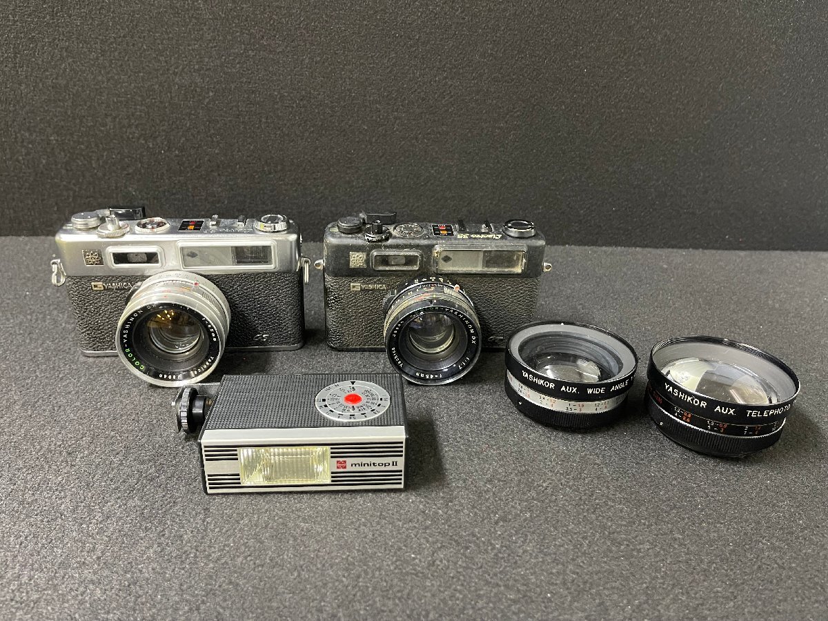 SN0604-56I ゆうパック着払い YASHICA ELECTRO 35 レンズ2本＆ストロボ付き フィルムカメラ 2台まとめて ヤシカ ジャンクの画像1