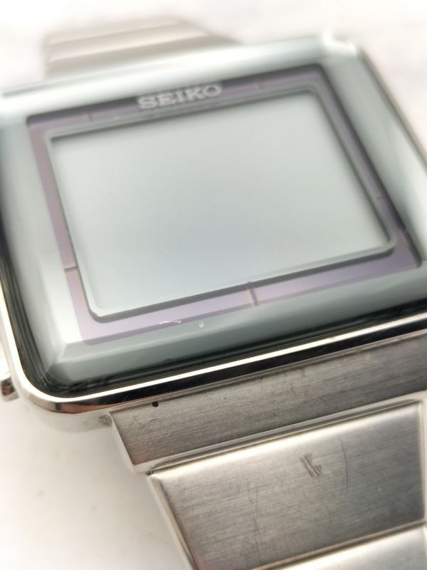 C134 1円～ ※不動品※ セイコー SEIKO スピリット S771-0AA0 デジタル ソーラー 腕時計 スクエア型 ステンレス シルバーカラー メンズの画像9