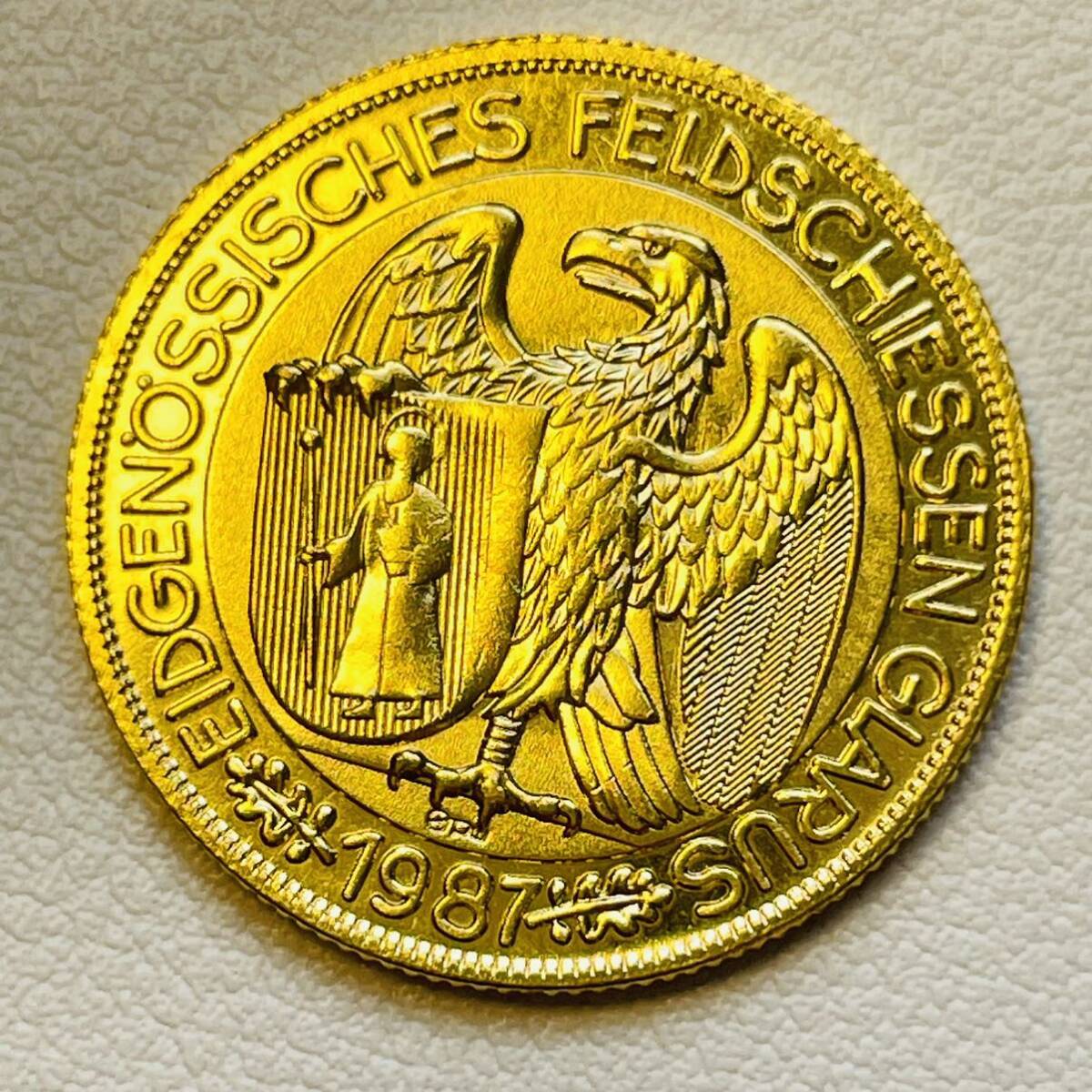 スイス 硬貨 古銭 1987年 グラールス射撃祭 グラールスの腕を掴むワシ ライフル 旗 50フラン 記念メダル コイン 重5.63gの画像1