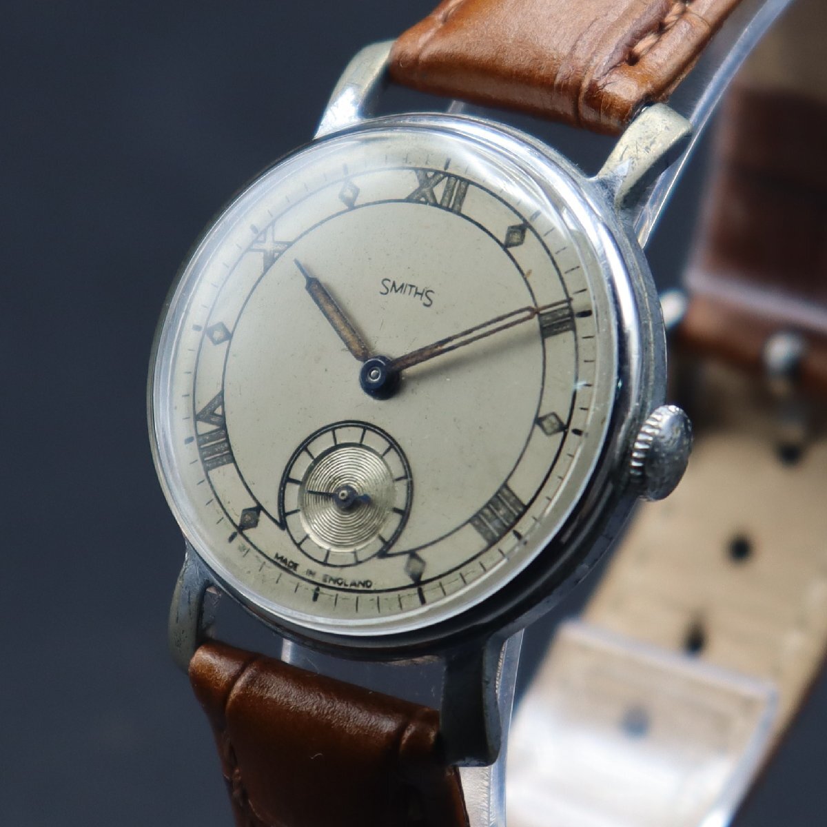 SMITHS スミス 手巻き スモールセコンド 飛びローマン文字盤 シルバーカラー 英国アンティーク メンズ腕時計の画像1