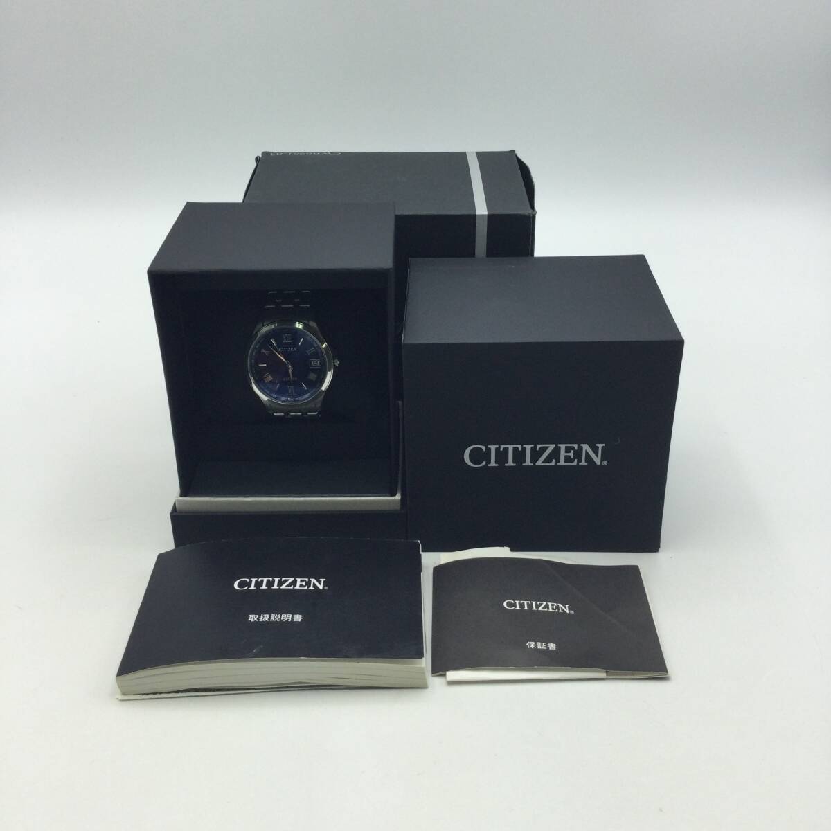 HH11◇<ソーラー/稼働>腕時計 CITIZEN シチズン H149-T021727 EXCEED エクシード 電波ソーラー デイト 青文字盤 ケース付き 現状品 ◇