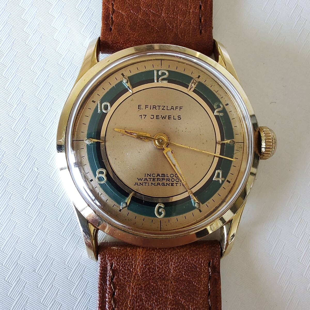 *E.FIRTZLAFF old hand winding type wristwatch for man gold color 