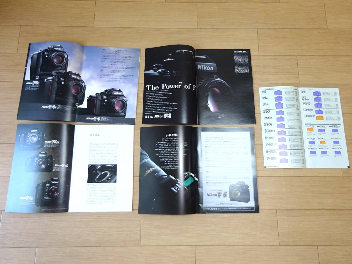 Nikon F4  каталог 3 вид   1991,1994,1996 издание  F5 каталог  ... стул ...  Nikon   в настоящее время  вещь 