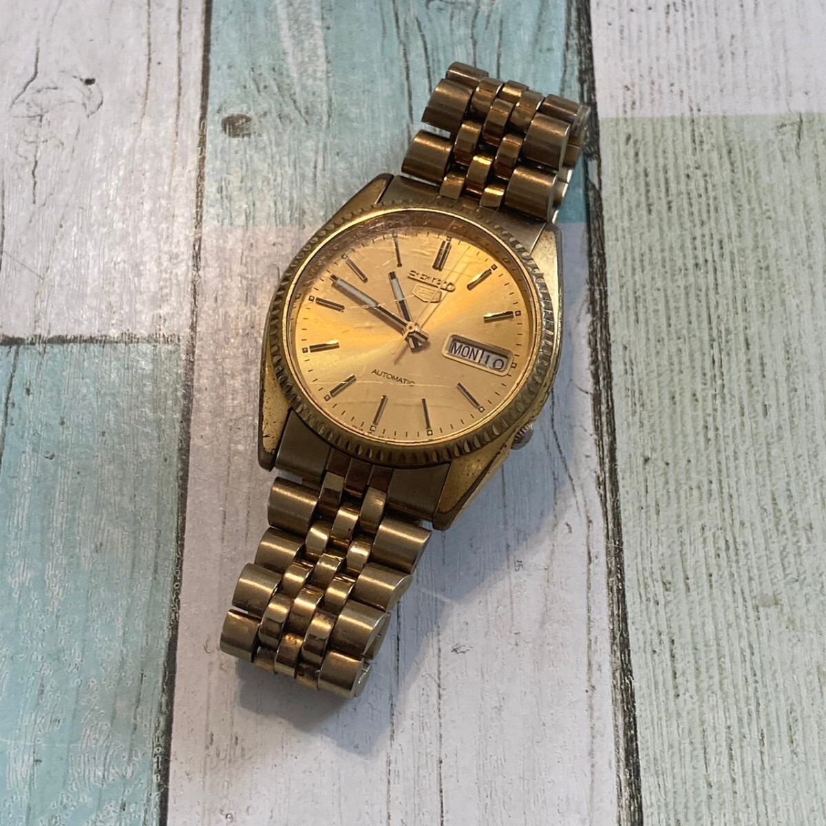 ◆稼働品◆人気◆ SEIKO/セイコー 5ファイブ 7009-3110 ゴールド文字盤 ゴールドカラー 自動巻き SS メンズ腕時計