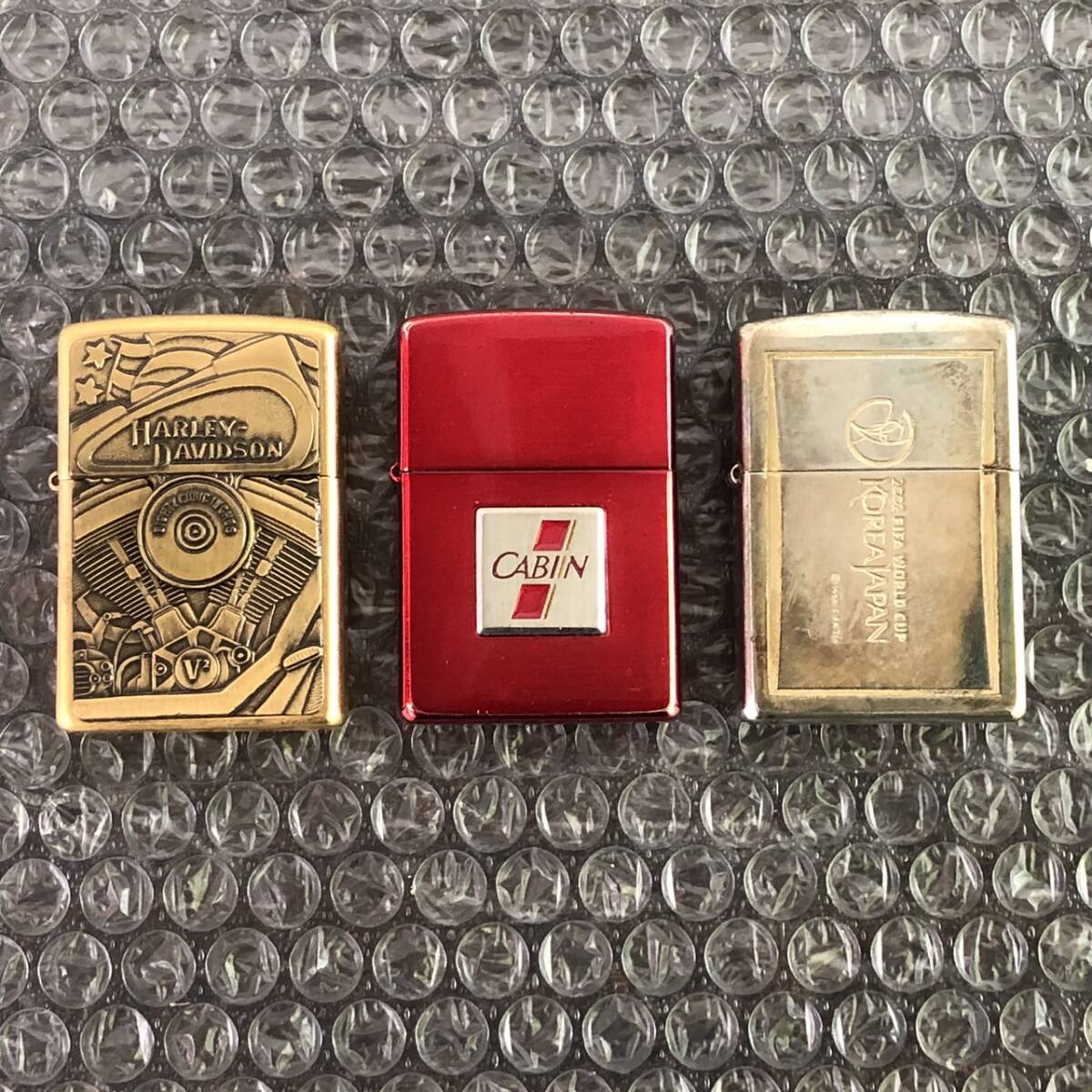 YA099201(051)-118/YS3000【名古屋】Zippo ジッポー 3点まとめ L XⅤ HARLEY-DAVIDSON / K XⅤ CABIN NEW 2000 / A 01 2002 FIFA WORLD CUPの画像1