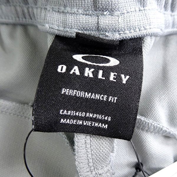 OAKLEY Oacley новый товар . пот скорость .AQUADRY одноцветный стрейч укороченные брюки Golf одежда FOA403576 27B XL ^017Vbus1377e