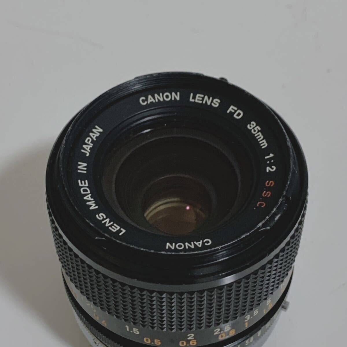 Canon Canon LENS FD 35mm 1:2 S.S.C F2 single burnt point camera lens Junk 