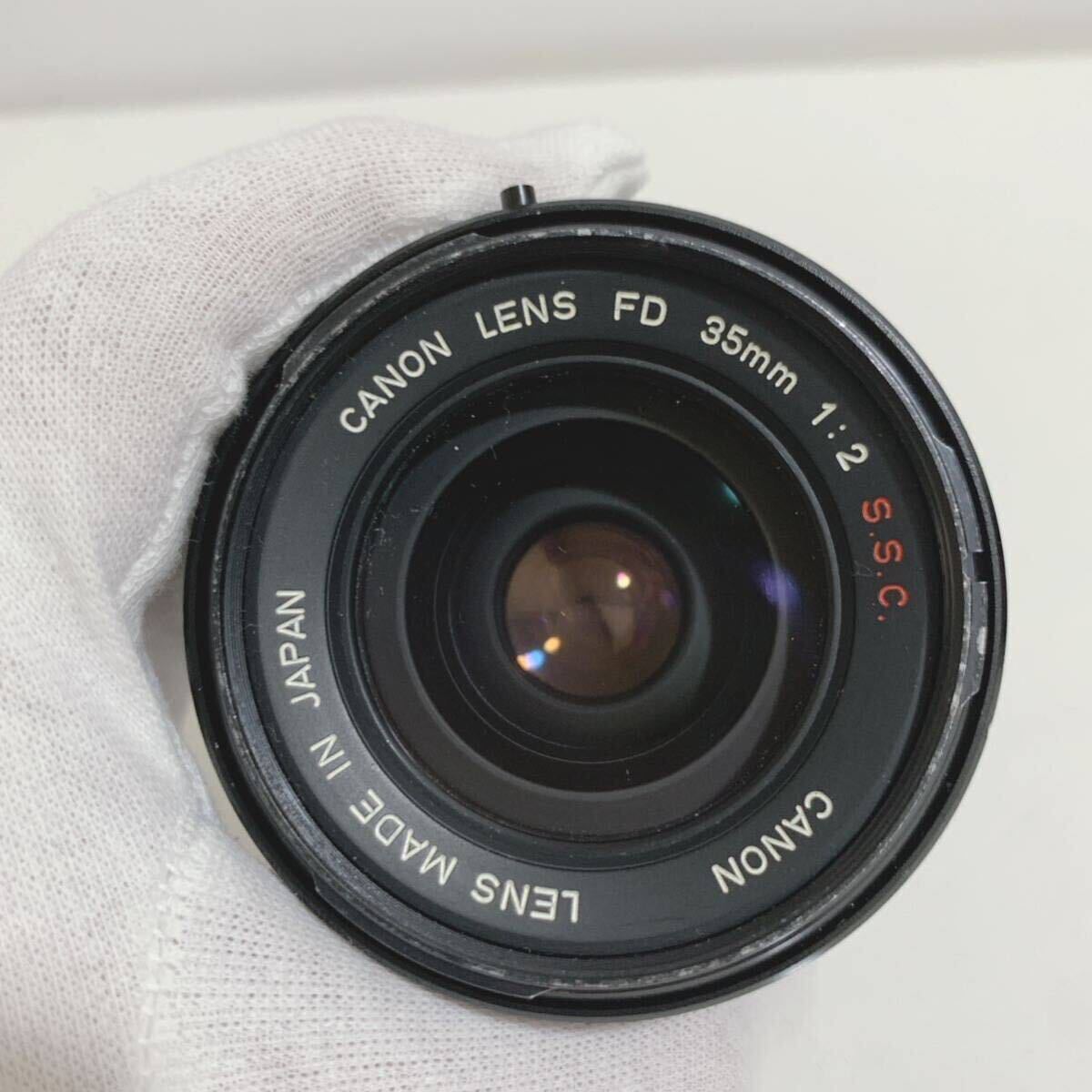 Canon Canon LENS FD 35mm 1:2 S.S.C F2 single burnt point camera lens Junk 