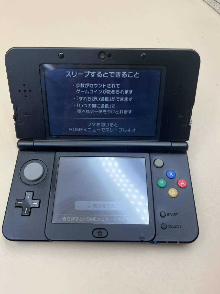 【通電動作確認済み】 Nintend 任天堂 new ニンテンドー 3DS 本体 KTR-001 ブラック 充電器 モンスターハンターカセット 付 の画像4