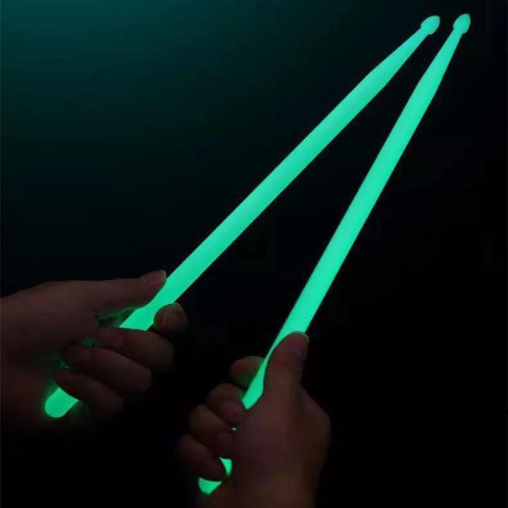  shines drum stick fluorescence conspicuous neon night light . light Live green 