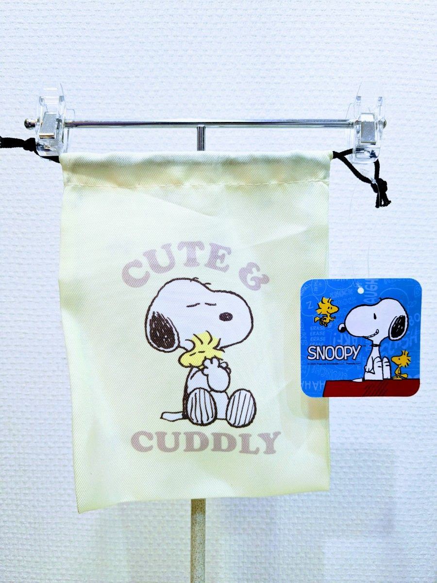 新品タグ付き。SANRIO サンリオ：SNOOPY スヌーピー・巾着ポーチ