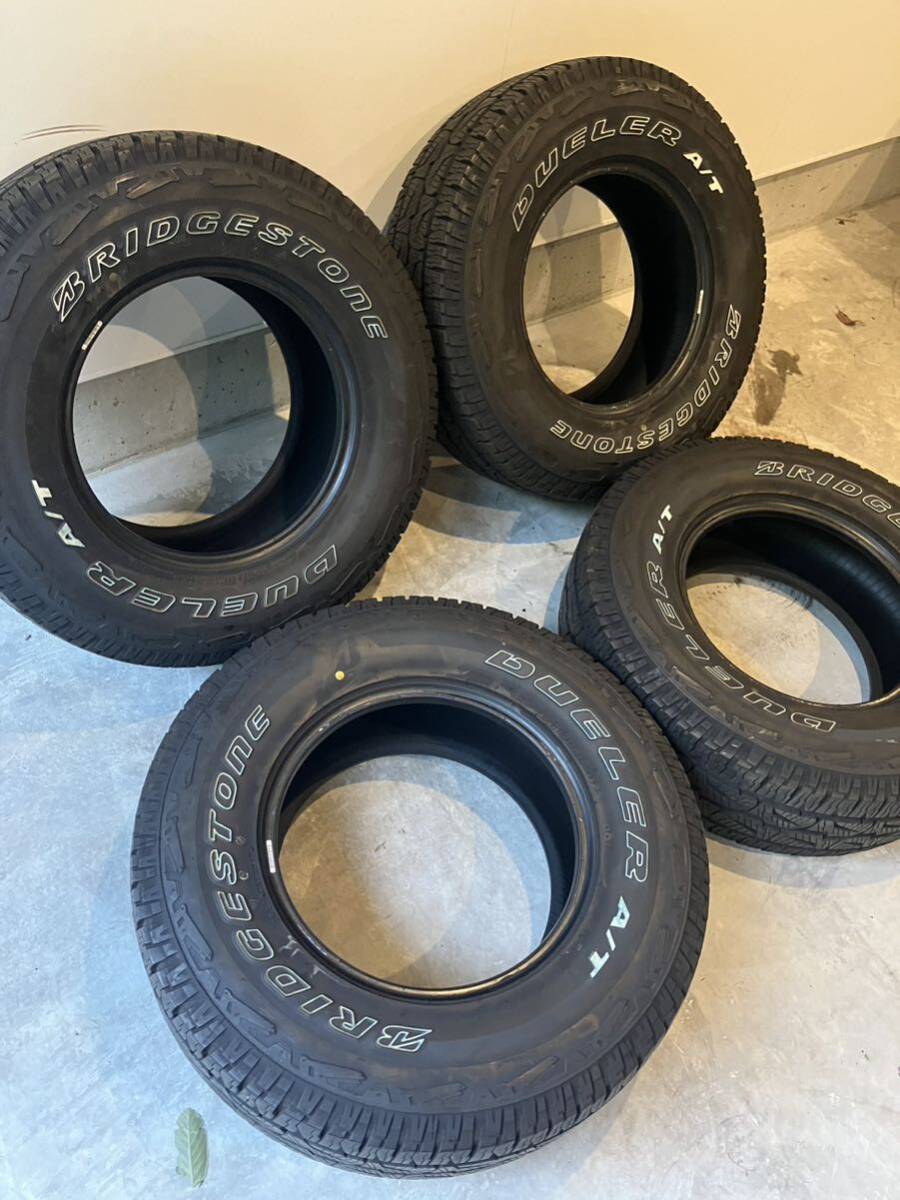 ブリヂストンDUELER A/T 265/70R16 16インチ 夏タイヤ 4本 ハイラックス 90プラド ランクル70 ランクル60 バリ山　ホワイトレター_画像1