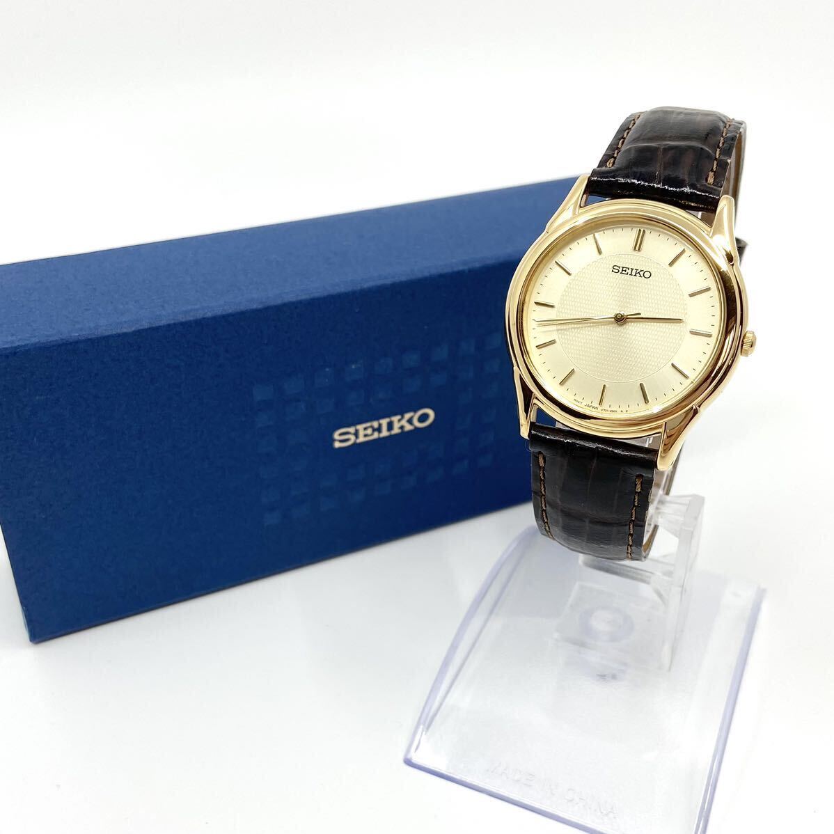 箱付き SEIKO 腕時計 V701-1920 ラウンド バーインデックス 3針 クォーツ quartz ゴールド 金 セイコー Y807