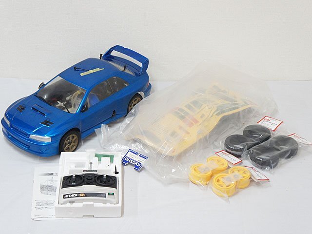 2577【京商 1/8 スーパーエイト ランドマックス インプレッサWRX 未開封ボディ ランチアストラトス タイヤ・ホイール未使用品付 】の画像1