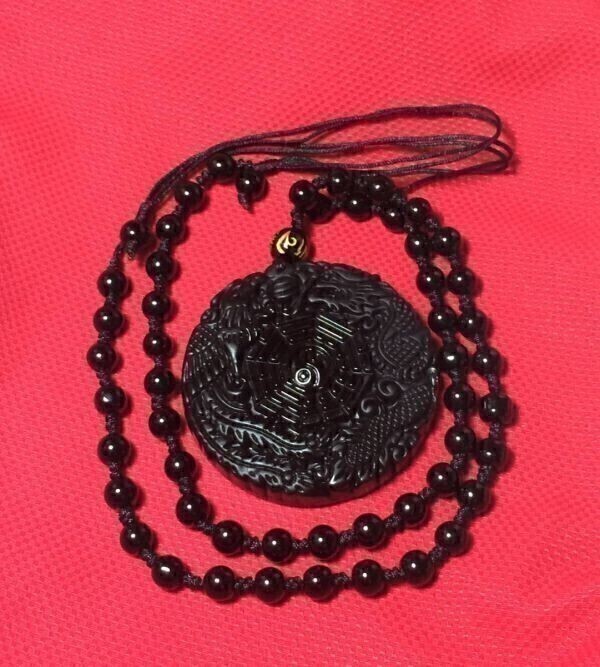  strongest amulet better fortune black . stone pendant Power Stone un- . bird . dragon . left right . placement at the center .. futoshi ultimate . sphere .....012027A2