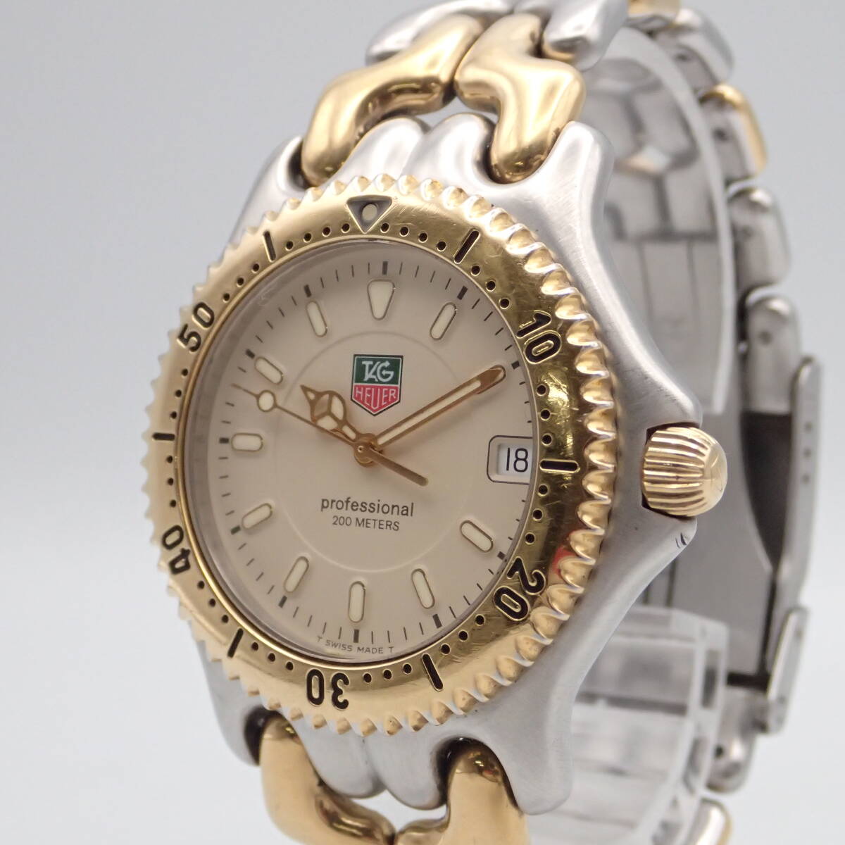 e04036/TAG HEUER TAG Heuer / Professional / quarts / men's wristwatch /200M/ face ivory /WG-1121-0/ parts coming off 