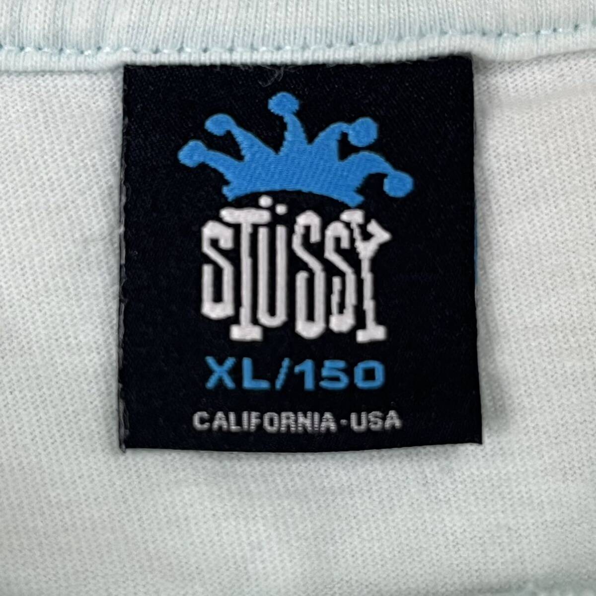 M■ 希少 STUSSY ca28629 World tour ステューシー ワールドツアー キッズ 半袖Tシャツ XL 150サイズ ブルー 水色 ロゴ ペイント柄 
