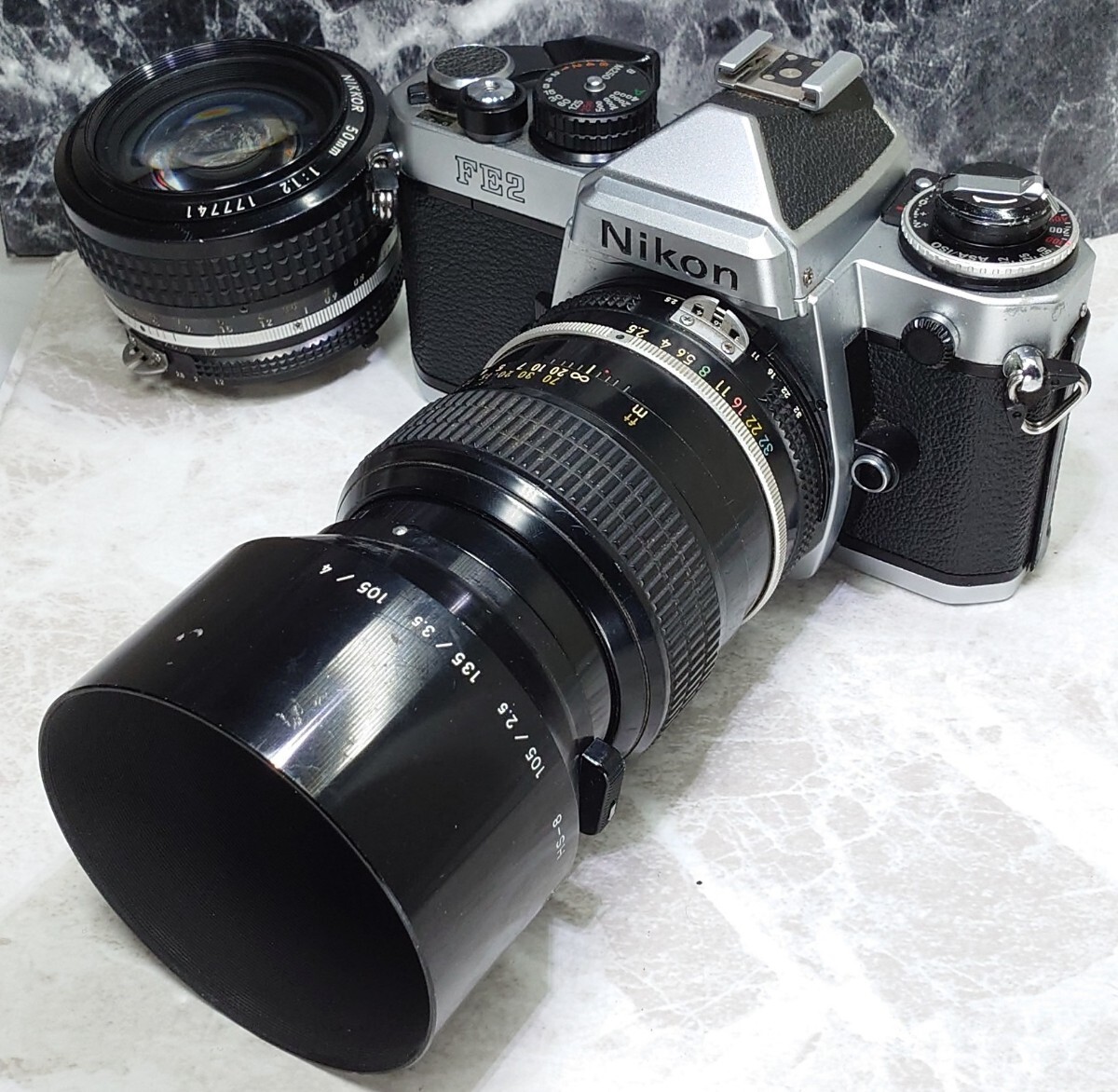 【終活整理】 Nikon FE2＋Ai NIKKOR 50mm f1.2 シンデレラ＋105mm f2.5 中望遠 単焦点2本セット 各動作良好 露出計OK 外観光学良好 説明書