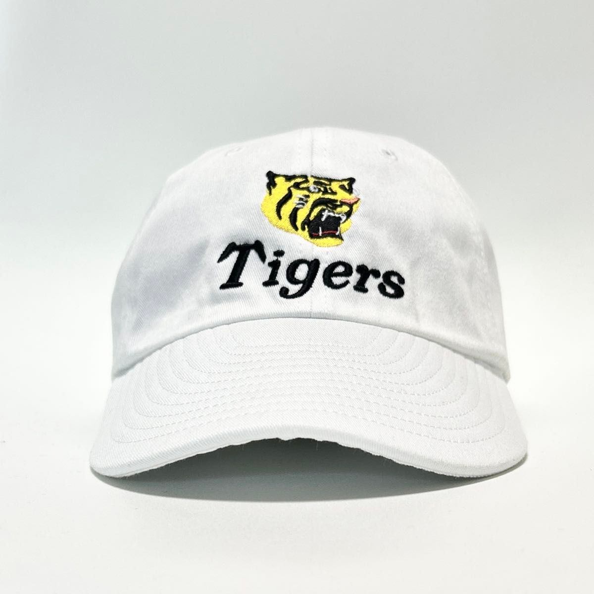 阪神　タイガース　tigers 虎　プロ野球　 野球帽　ユニフォーム　ロゴ 刺繍 キャップ 帽子　白　優勝記念　スポーツ