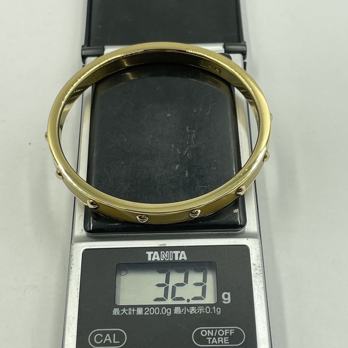 E175-SK10-558 ◎ COACH コーチ レディース ブレスレット バングル ゴールドカラー 腕回り:約20cm 重量:約32.3g 保存袋付きの画像9