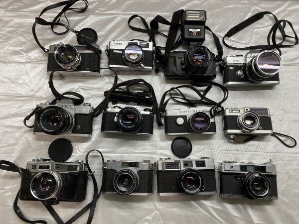 E5-143 【ジャンク・現状品】 フィルムカメラ まとめて 計12点 セット レンズ YASHICA Canon minolta OLYMPUS KONICA PENTAXの画像1