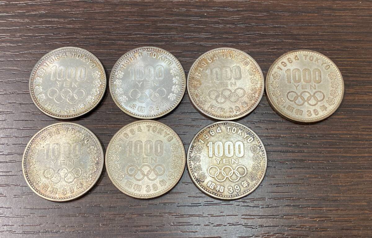 #10674-S 1000円銀貨7枚　 東京オリンピック記念　1000円銀貨　記念硬貨　千円銀貨　1964年　1000円硬貨_画像1