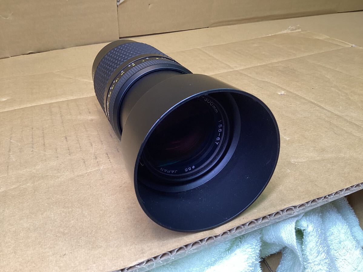 Tokina camera lens AF 100-300mm 1:5.6-6.7 55 pie Kenko filter 