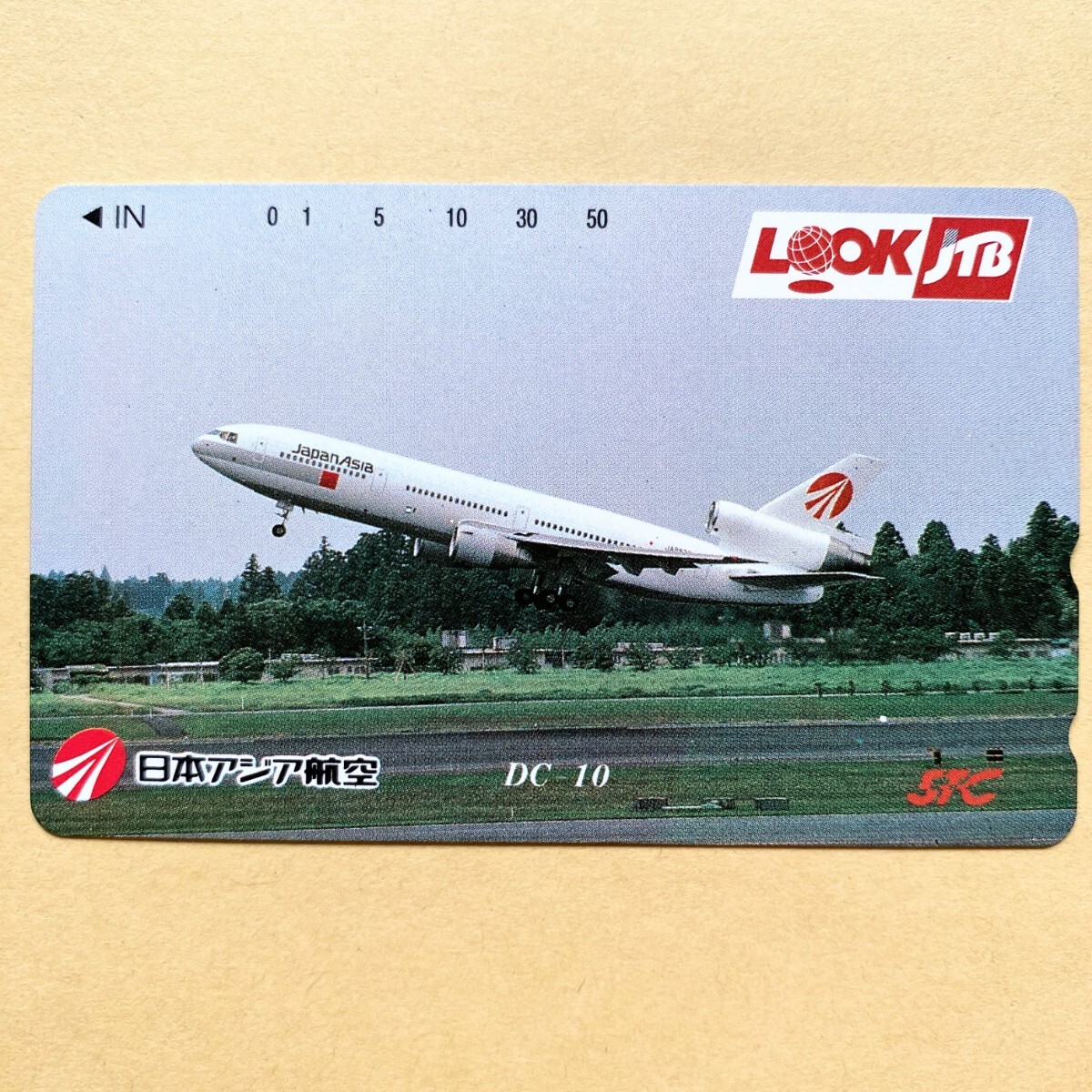 【未使用】航空機テレカ 50度 日本アジア航空 DC10 LOOKJTBの画像1