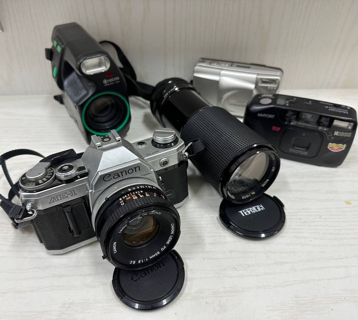 ◇A4179 Canon AE-1 TEFNON 京セラ SAMURAI X3.0 オリンパス リコー カメラ レンズ おまとめ 動作未確認 ジャンク 保管品◇の画像1