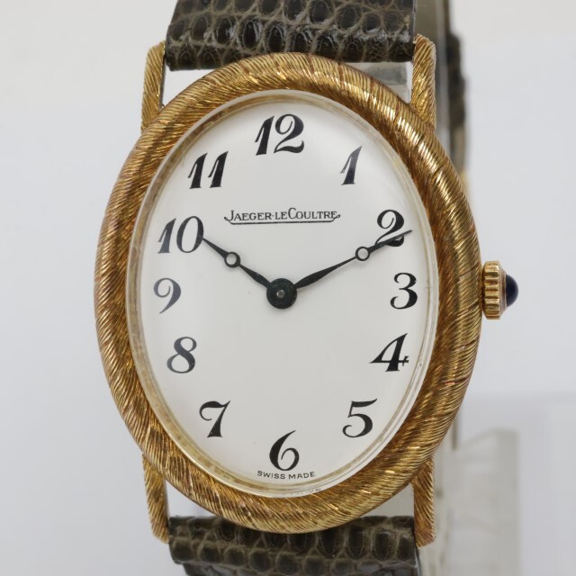 2404-619 ジャガールクルト 手巻き式 腕時計 本体 K18 750 縦オーバル 白文字盤 全数字 竜頭装飾 リザードベルトの画像1
