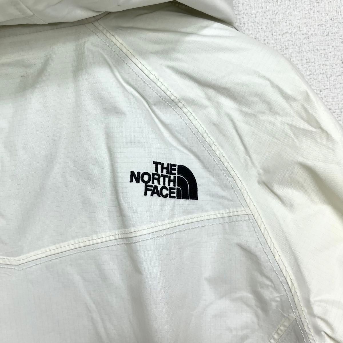 美品人気 ノースフェイス マウンテンパーカー レディースM 透湿防水 フード収納可 THE NORTH FACE ロゴ刺繍