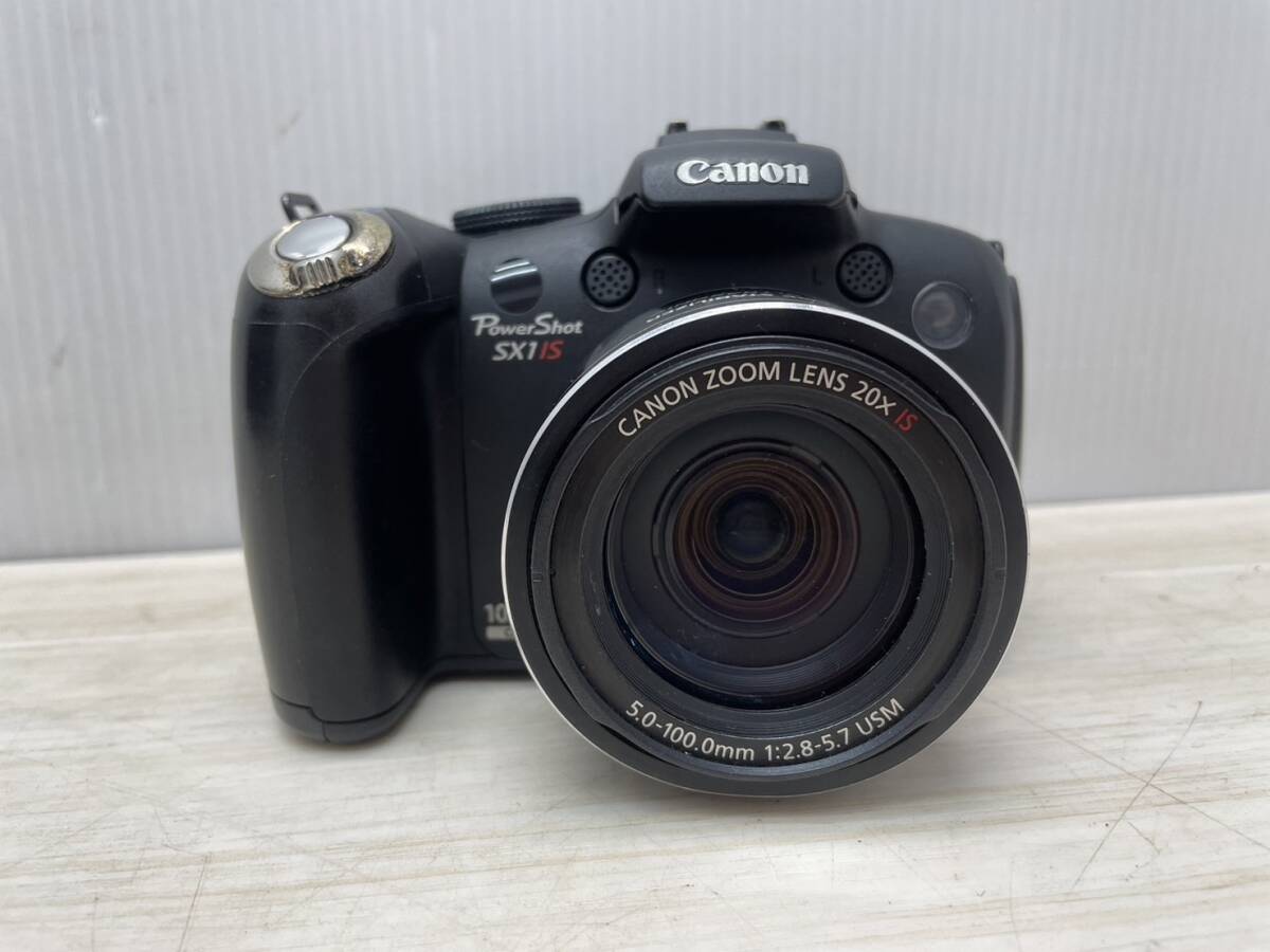 送料無料S84527 CANON キャノン PowerShot SX1 IS デジタルカメラ 5.0-100.0mm 1:2.8-5.7 USM デジカメ_画像1