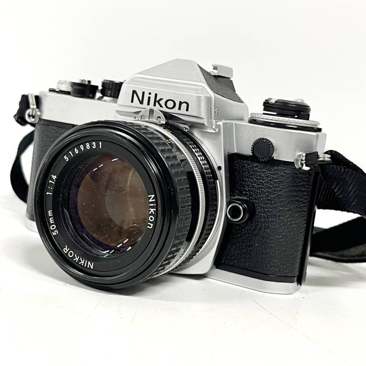 1円~【動作未確認】ニコン Nikon FE NIKKOR 50mm 1:1.4 一眼レフ フィルムカメラ 単焦点レンズ 標準レンズ ストラップ付き G102144_画像1