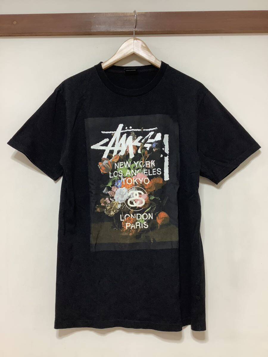 は1315 STUSSY ステューシー ワールドツアー ボタニカル 花柄 半袖Tシャツ プリントTシャツ M ブラック ストリート の画像1